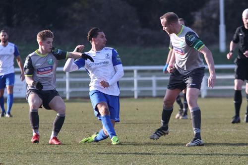 Enfields Sam Youngs gets his pass away despite the attentions of Nathan Wood (L) and Lee Minshull