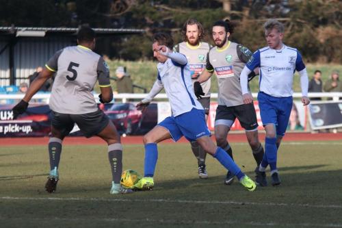 Enfields Sam Youngs runs at Jerry Nnamani