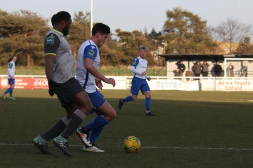 Enfields Samir Bihmoutine (R) and Leatherheads Jerry Nnamani