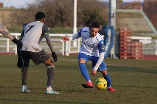 Enfields Tyler Campbell (R) runs at DSean Theobalds