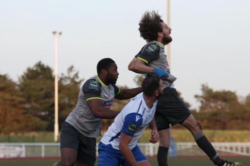 Leatherheads Jack Midson (R) heads clear ahead of Jerry Nnamani (L) and Mat Mitchel-King