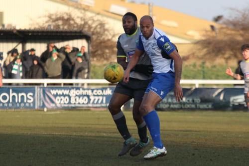 Leatherheads Jerry Nnamani (L) and Enfields Simon Thomas