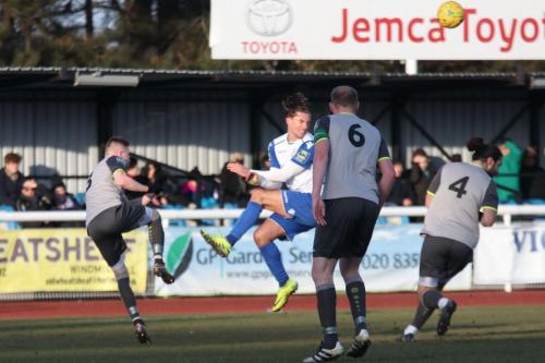Leatherheads Tom Richards (L) clears from Sam Youngs