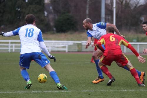 Enfields Aaron Greene (wearing the no 18 blood shirt as the result of a nosebleed) and Simon Thomas and Needhams Dan Morphew