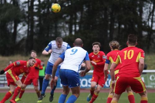 Enfields Mark Kirby heads wide at a set piece