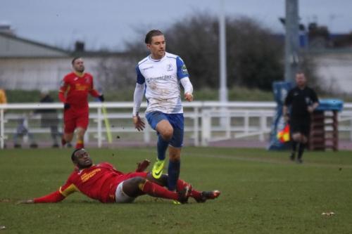 Needhams Jeremiah Kamnazi (red) challenges Sam Youngs