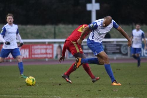 Needhams Jeremiah Kamnazi (red) challenges Simon Thomas