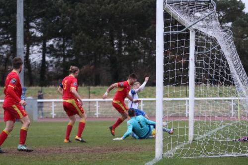 Needhams John Sands (red, R) and keeper Danny Gay combine to deny Ryan Blackman