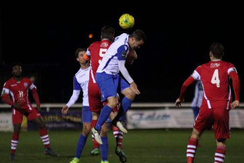 Enfields Liam Hope (white, R) challenges Sonny Miles