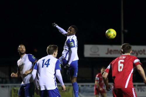 Enfields Ryan Blake jumps for a header watched by Mat Mitchel-King (L), Ben Ward-Cochrane (14) and Liam Smith