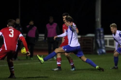 Enfields Sam Youngs (white) clears from Joe Turner