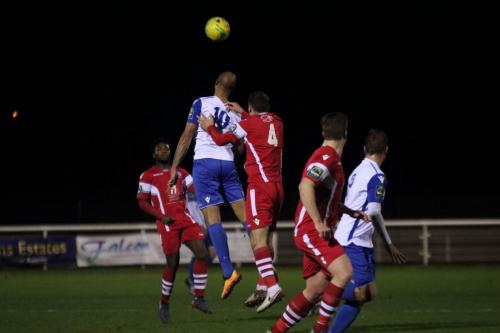 Enfields Simon Thomas (10) challenges Craig Stone