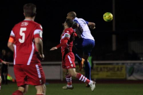 Enfields Simon Thomas (R) challenges Craig Stone