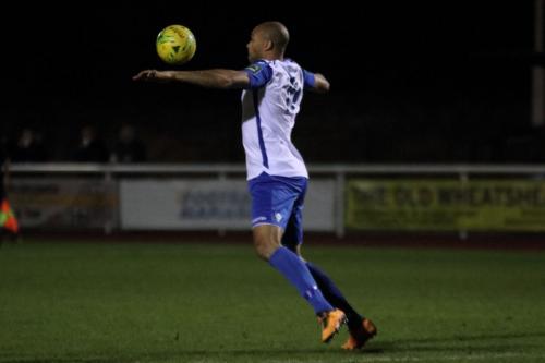 Simon Thomas chests the ball down