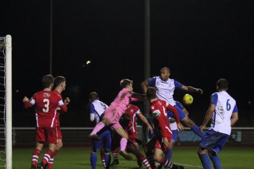 Tonbridge keeper Jonathan Henly punches clear