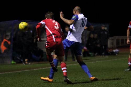 Tonbridges Jack Parter (L) clears from Simon Thomas