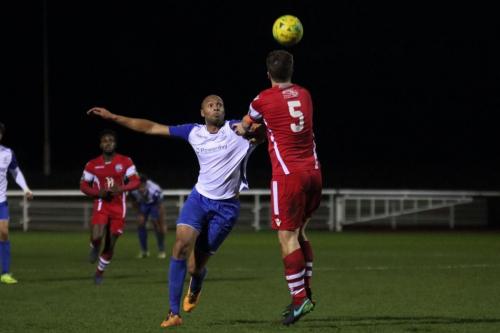 Tonbridges Sonny Miles (5) heads clear from Simon Thomas