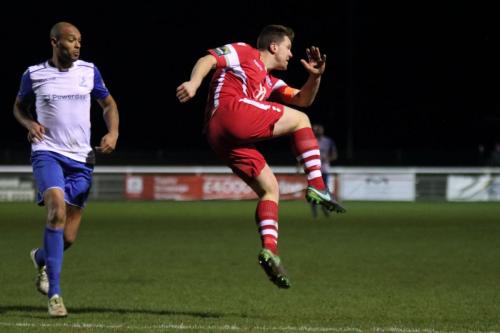 Tonbridges Sonny Miles (R) clears from Simon Thomas