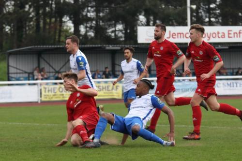 Enfields Dernell Wynter (white, R) shoots just wide