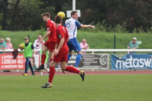 Enfields Liam Hope (white) challenges Jared Rance