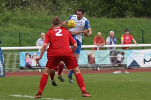 Enfields Matt Johnson (white) chests the ball down