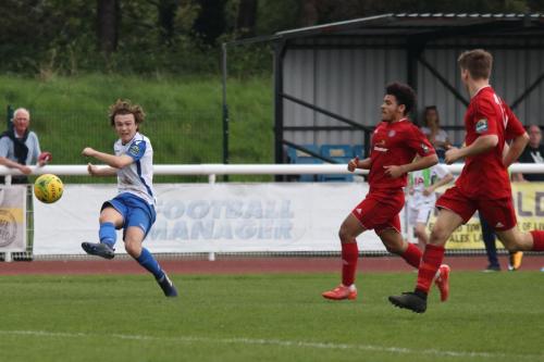 Enfields Mickey Parcell (L) crosses