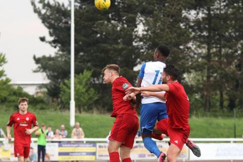 Enfields Ryan Blake wins a header against Joel Colbran (L) and Alex Parsons