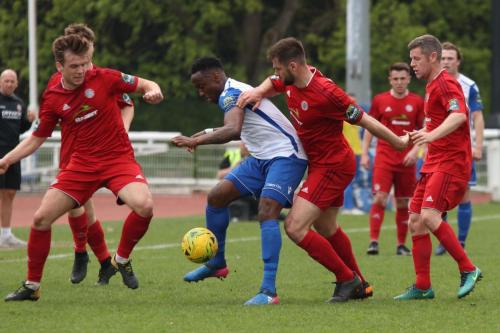 Worthings Alfie Young (L) and Aaran Racine challenge Ryan Blake
