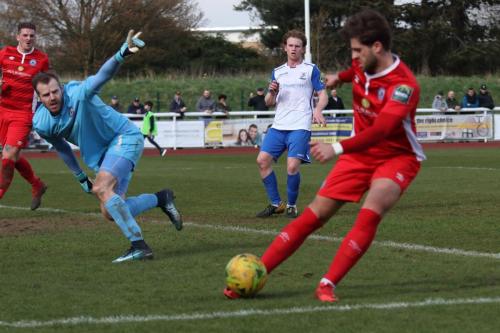 After saving from Sam Young  Billericay keeper Alan Julian tells Josh Urquhart where to put the ball