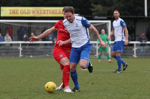 Billericays Jake Robinson (L) challenges Matt Johnson