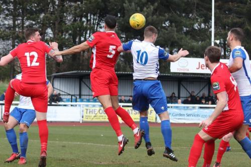 Billericays Joe Kizzi (5) challenges Brad Wadkins