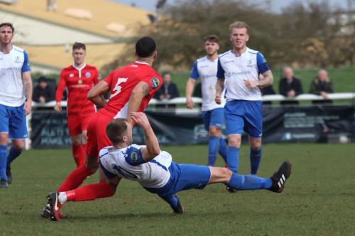 Billericays Joe Kizzi (red) and Enfields Brad Wadkins