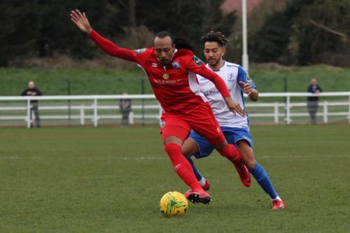 Billericays Ricky Modeste (L) and Enfields Tyler Campbell