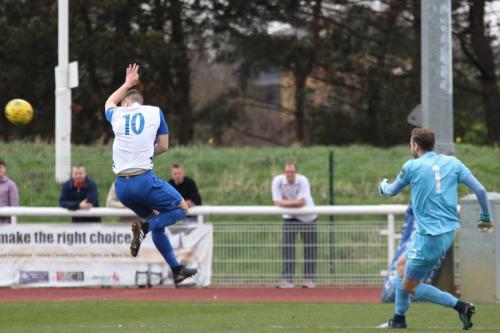 Enfields Brad Wadkins tries to charge down Alan Julians clearance