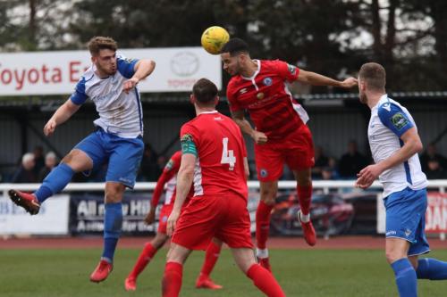 Enfields Dan Rumens (L) challenges Joe Kizzi