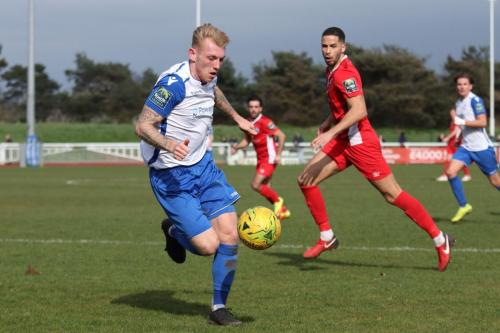 Enfields Ryan Blackman (L) breaks into the Billericay box