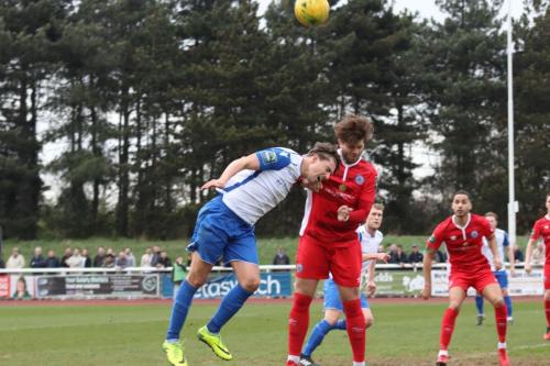 Enfields Sam Youngs (L) challenges Josh Urquhart