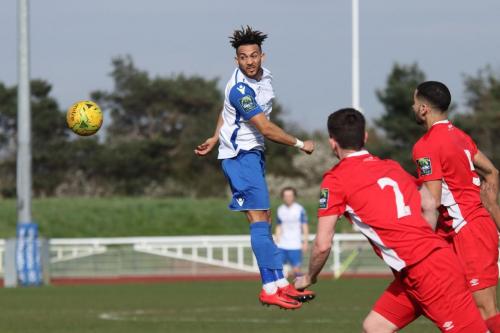 Enfields Tyler Campbell heads the ball past Kevin Foley (2) and Joe Kizzi