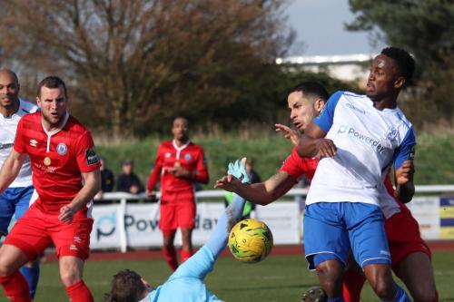 The ball runs loose in the Billercay box allowing Ryan Blake (R) to score Enfields stoppage time equaliser