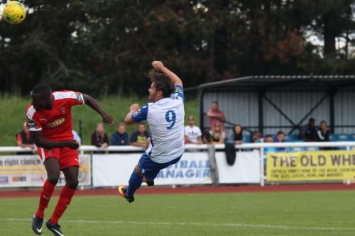 Enfields Drew Roberts (9) tries an acrobatic volley