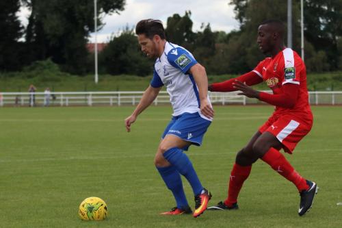 Enfields Drew Roberts (L) and Folkestones Salvyn Kisitu