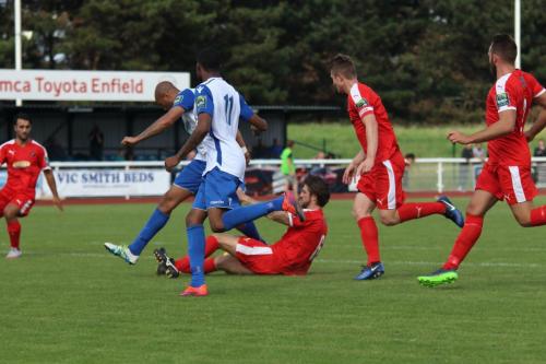 Folkestones Matthew Newman (red, 6) dispossesses Simon Thomas