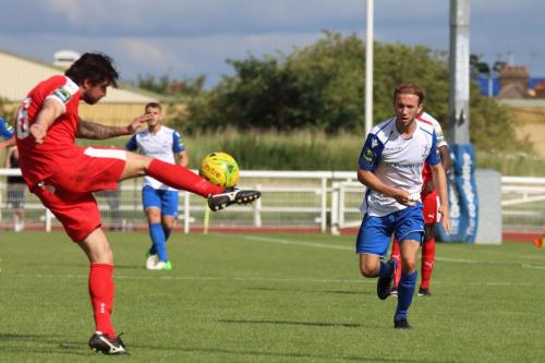 Folkestones Matthew Newman clears from Robbie Rees
