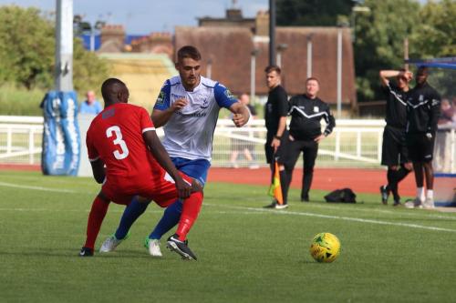 Folkestones Salvyn Kisitu (3) challenges Danny Rumens