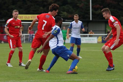 Folkestones Sam Hasler (7) challenges Ralston Gabriel