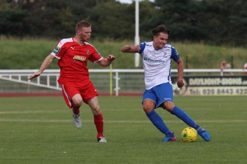 Folkestones Scott Heard (L) and Enfields Sam Youngs