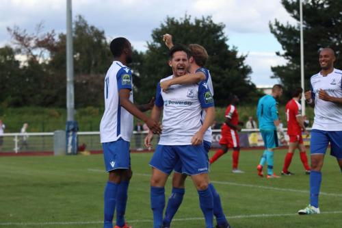 Ralston Gabriel (L), Robbie Rees and Simon Thomas (R)celebrate with scorer Drew Roberts