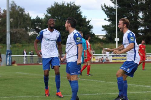 Ralston Gabriel (L) and Robbie Rees (R) celebrate with scorer Drew Roberts