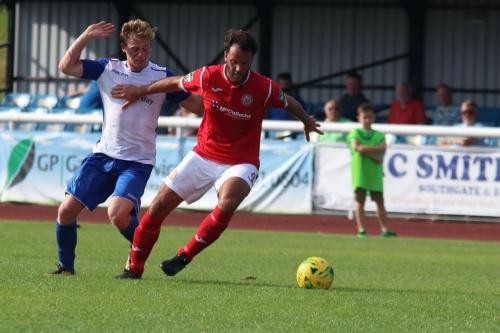 Enfields Aaron Greene (L) and Harlows James Baker