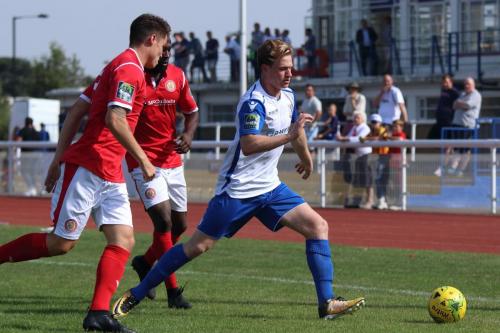 Enfields Aaron Greene breaks clear of James Shepherd (L) and Junior Dadson